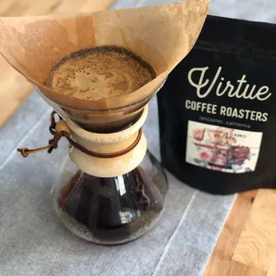 a coffee filter and a bag of coffee