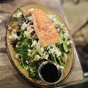 This salad was bountiful and filling . The thick balsamic drizzle compliments the fresh goat cheese in this salmon said very well.