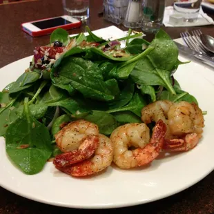 Spinach, blueberry, strawberries, shrimp, toasted coconut and champagne vinaigrette salad...tasty.