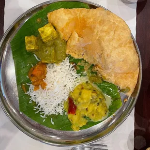 A little bit of everything (puri masala, palak paneer)