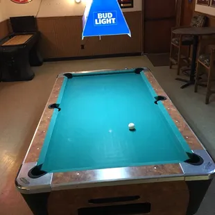 a pool table in a bar