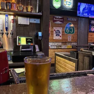 a pint of beer on the bar