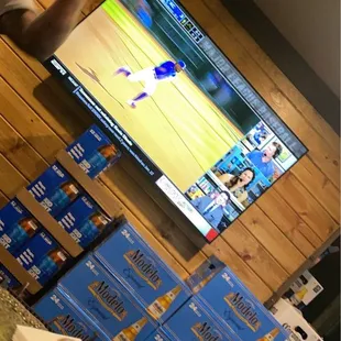 a man watching a baseball game on tv