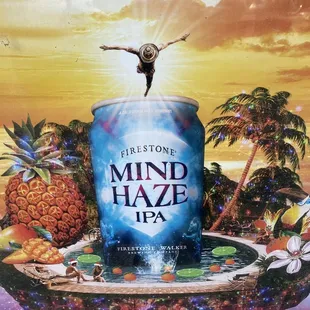 a man standing on top of a can of mind haze ipa