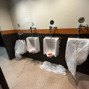 At the height of the convention, this is THE men's room with leaks, slippery floors and broken stalls.