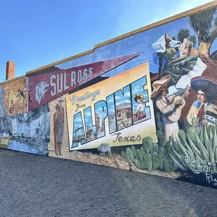 Entrance just to the right of this beautiful mural