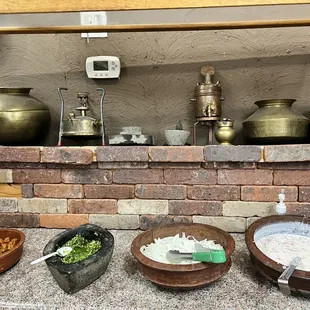 various bowls of food on a counter
