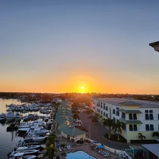 a sunset over a marina