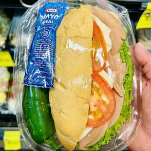 Sandwich made here complete with side of fresh jalapeño