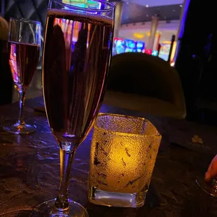 two glasses of wine and a candle