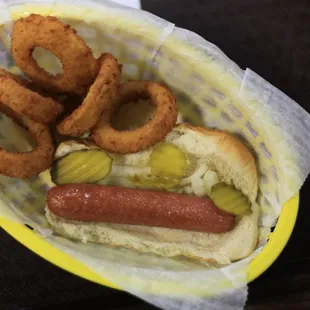 A hotdog made with little care and onion rings fried in very old oil that taste like old fish.