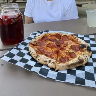 Pepperoni cheese oven brick baked pizza with huge sangria