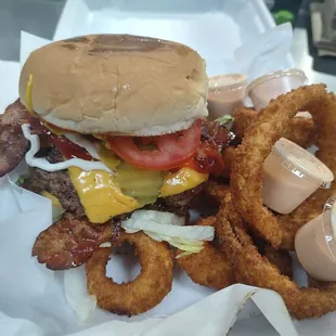 Cheese burger with onion rings.