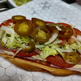 a sub sandwich with toppings