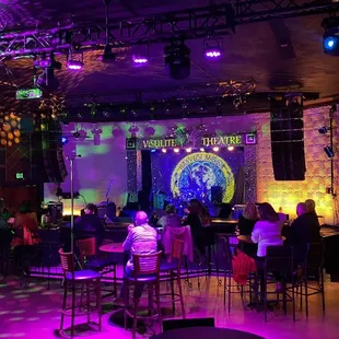 a crowd of people sitting at tables