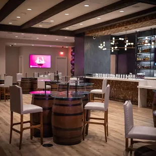 a bar with wine barrels