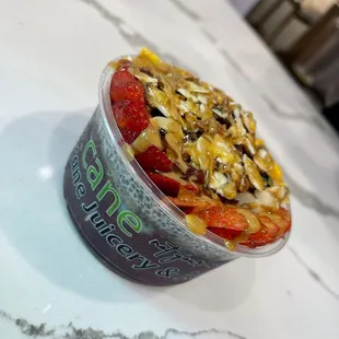 a yogurt filled with fruit and nuts