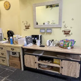 a coffee station with a coffee maker
