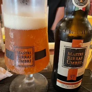 a glass of beer and a bottle of beer