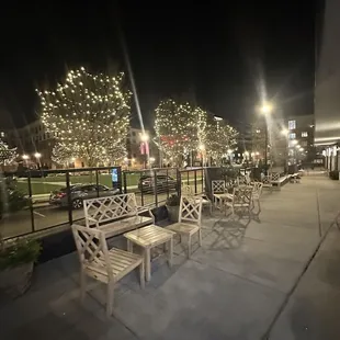 a row of park benches at night