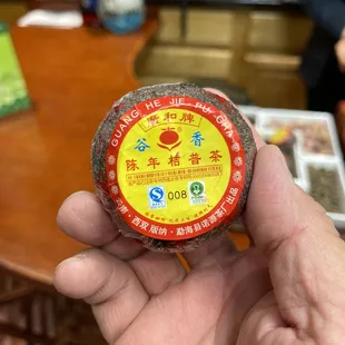 a person holding a cup of tea