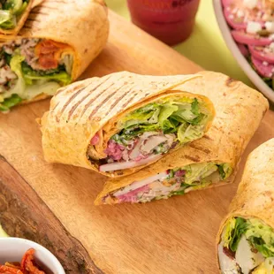 a sandwich cut in half on a cutting board