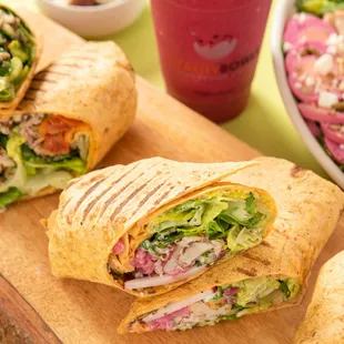 a sandwich cut in half on a cutting board