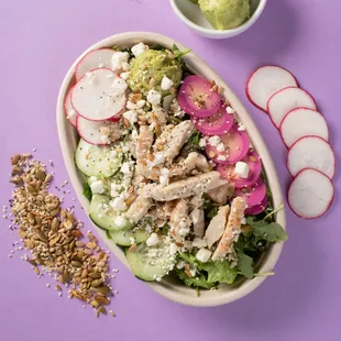 a salad with chicken and radishes