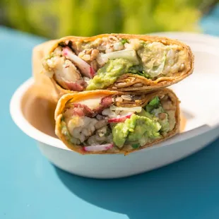 a burrito with guacamole