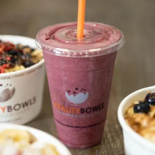 a smoothie and bowls of cereal