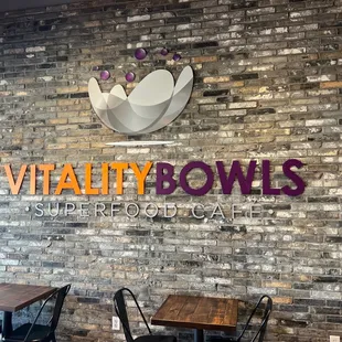 a brick wall and tables