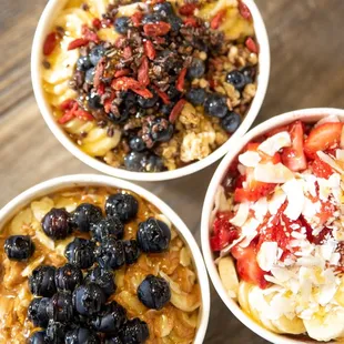three bowls of fruit and oatmeal
