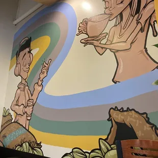 a mural on the wall of a restaurant