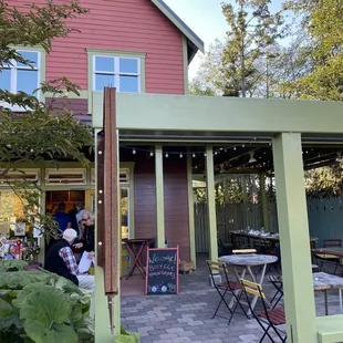 a patio with tables and chairs