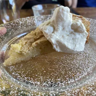 a slice of pie with whipped cream