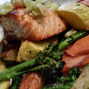 Salmon over veggies during a luncheon. .. Nice option