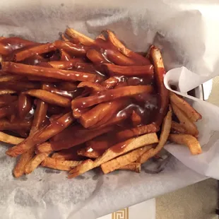 a basket of french fries with ketchup