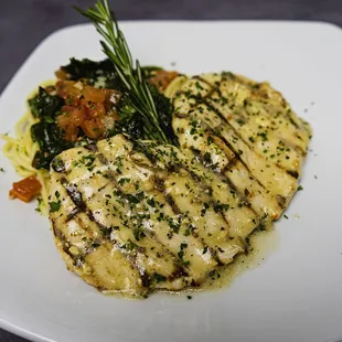 Lemon rosemary grilled chicken over a bed of angel hair pasta tossed in olive oil, spinach, diced tomatoes and fresh rosemary.