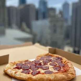 a pepperoni pizza in a box