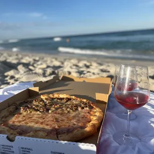 a glass of wine on the beach