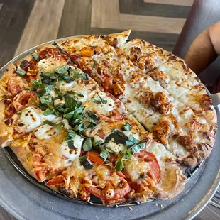 Half Margherita and Half Buffalo chicken pizza. Great thin crust