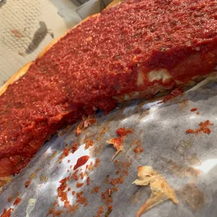 a piece of deep dish pizza
