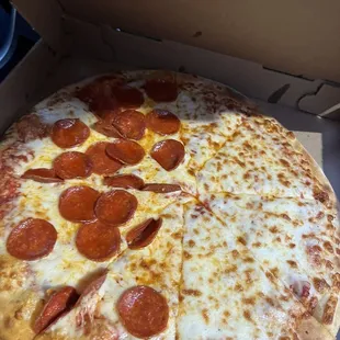 Large half cheese half pepperoni pizza.