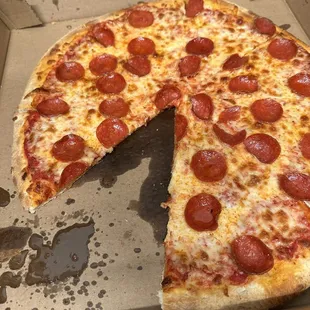 a half eaten pepperoni pizza