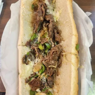 a sub sandwich with meat and cheese