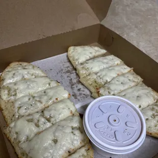 four slices of pizza in a box