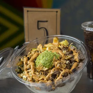 a bowl of food and a drink