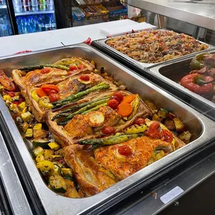 a variety of food in a buffet