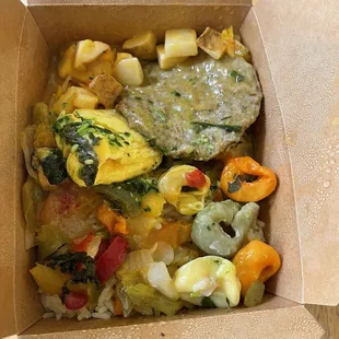 Tortellini, sausage patty, egg, and rice with curry sauce and some chimichurri.