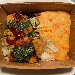 a meal in a box on a plate